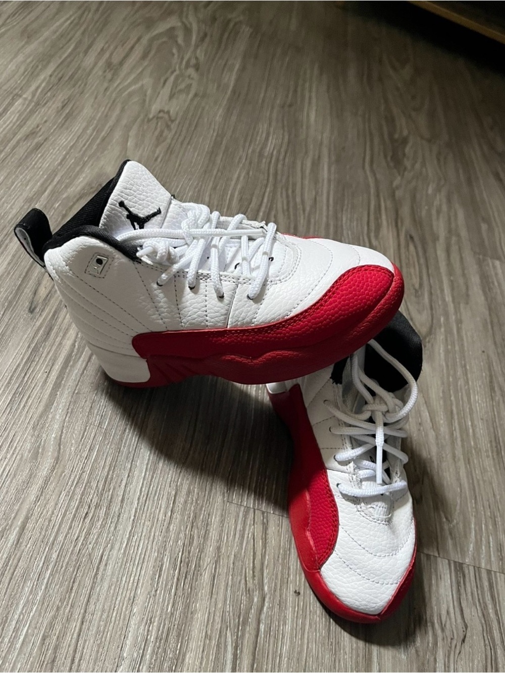 Boys red and white Jordan 12s